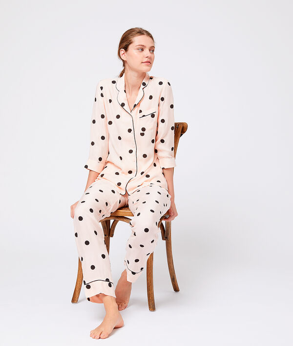 Pantalon à pois rose.