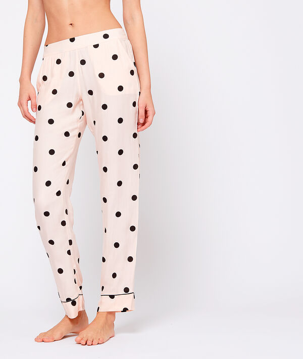 Pantalon à pois rose.