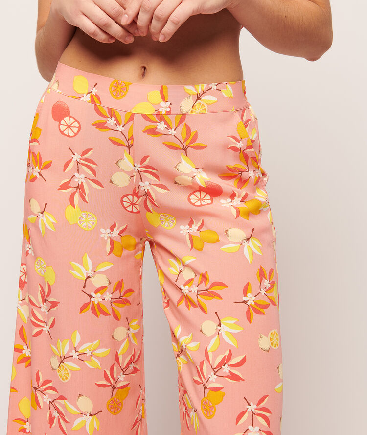 Pantalon imprimé fleuri rose.