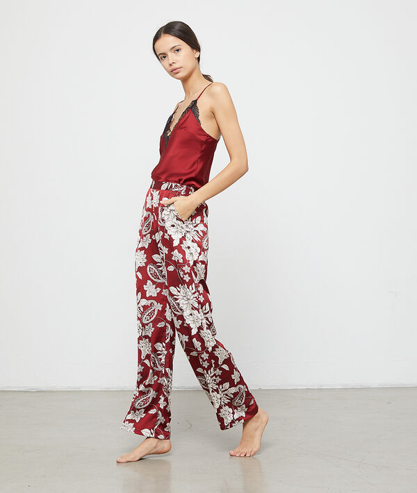 Pantalon satiné imprimé fleuri bordeaux.