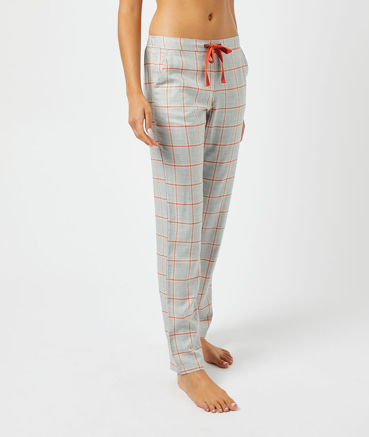 Pantalon à carreaux gris.