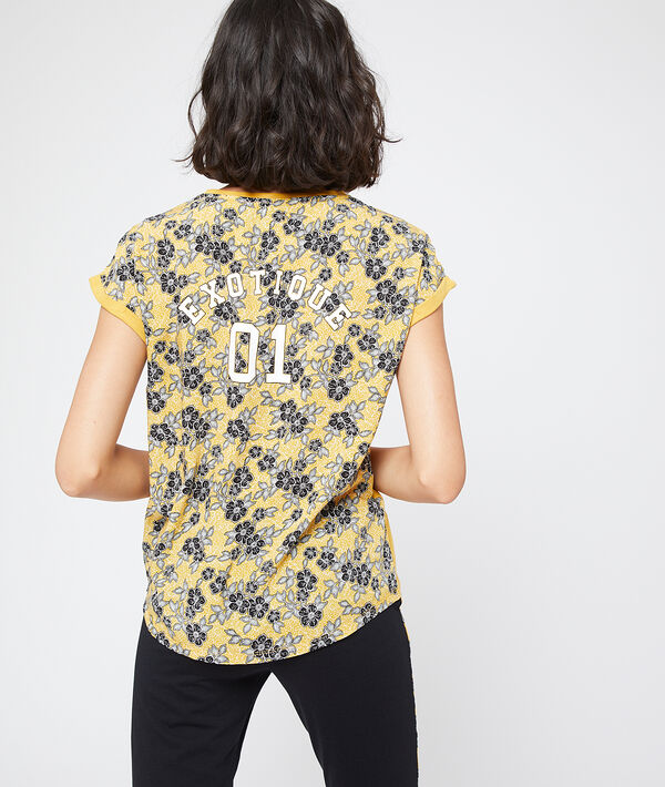 T-shirt dos fleuri message "Exotique" T-shirt dos fleuri message "Exotique"