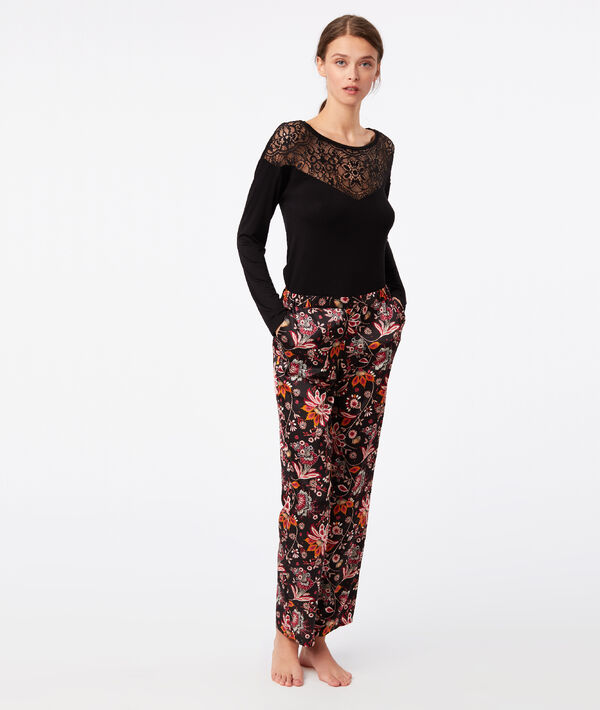 Pantalon large imprimé floral noir.