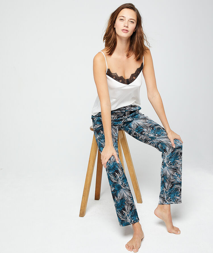 Pantalon imprimé feuillage noir.