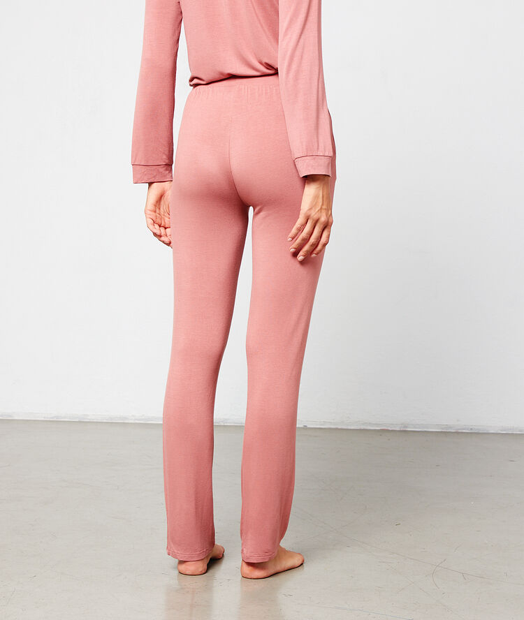 Pantalon de pyjama à bandes latérales rose.