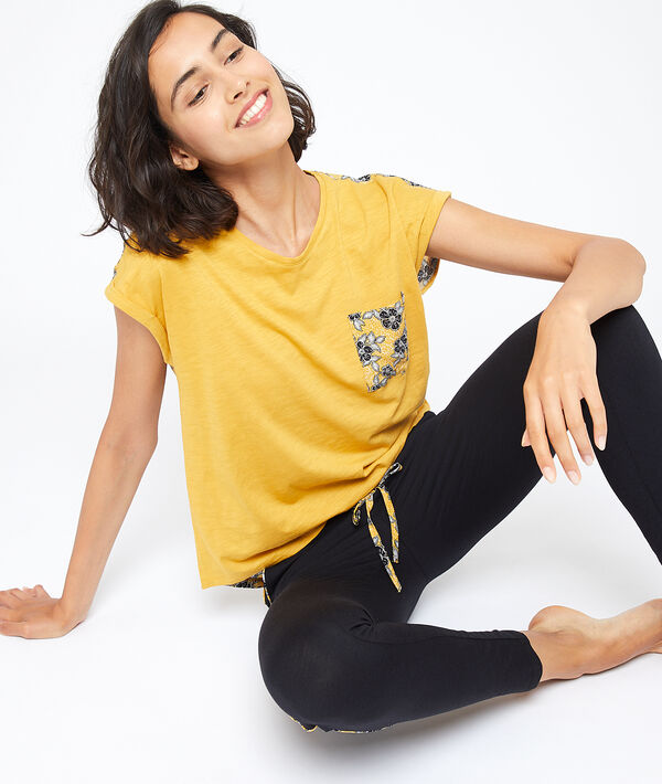T-shirt dos fleuri message "Exotique" T-shirt dos fleuri message "Exotique"