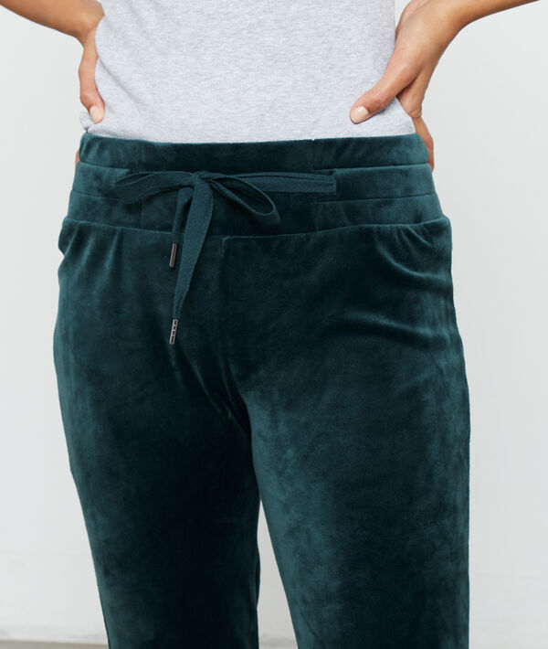 Pantalon effet velours vert.