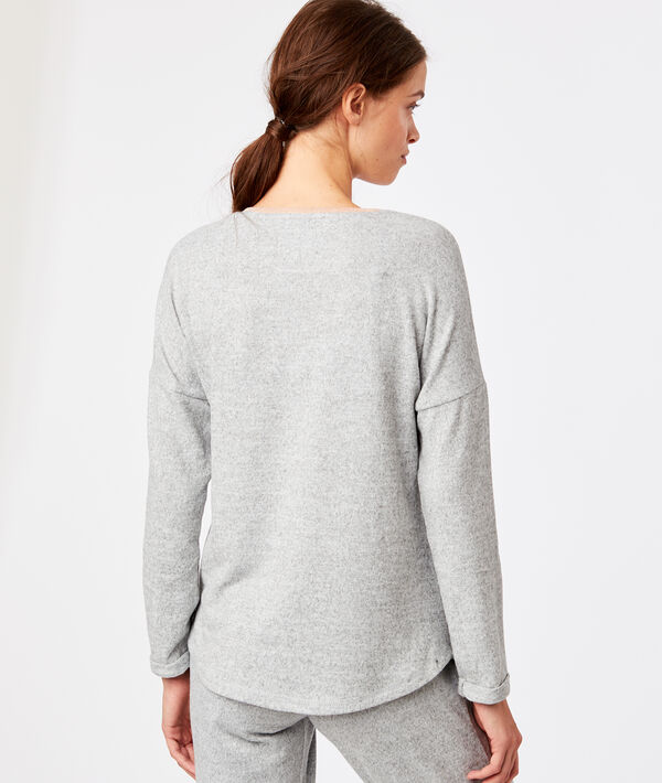 Top avec poche centrale gris.