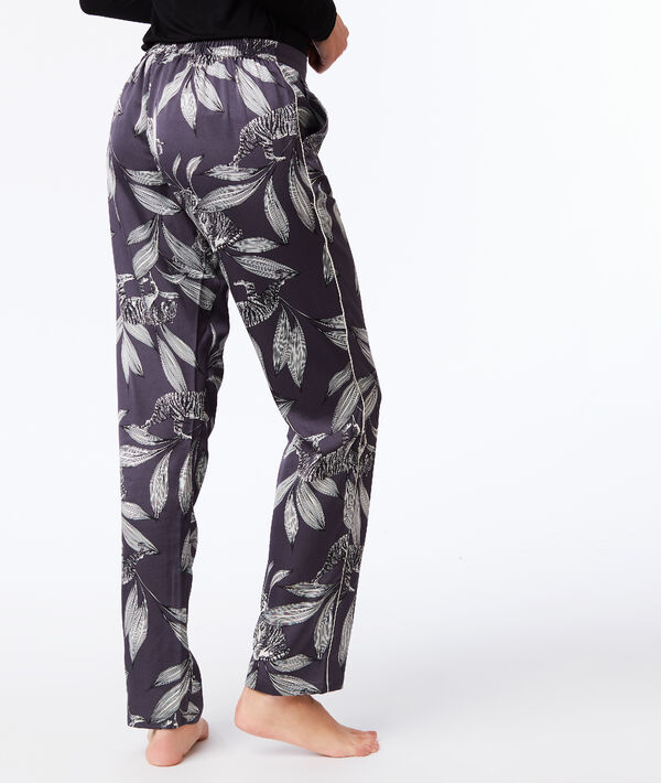 Pantalon large imprimé floral gris.