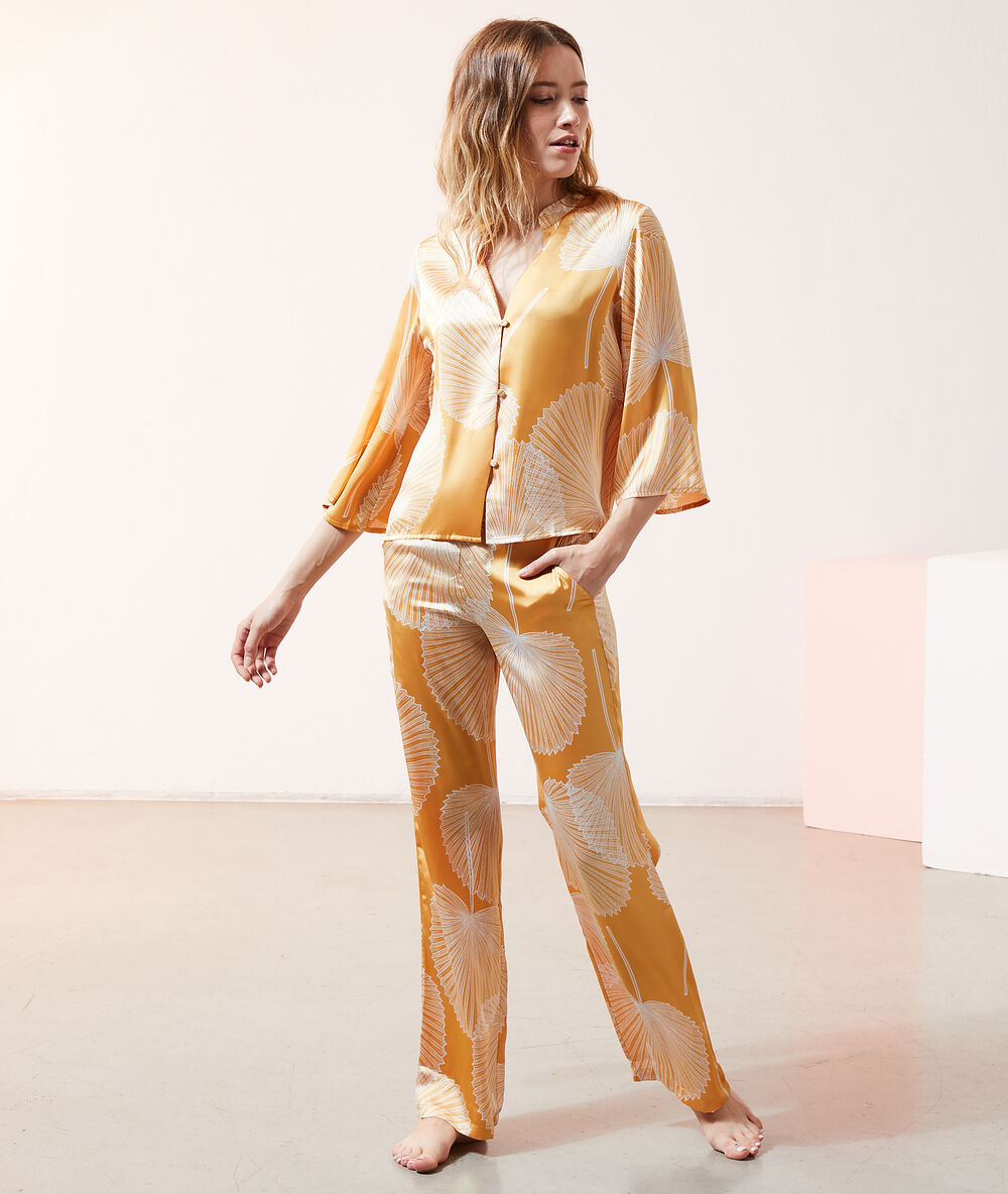 Pantalon satiné imprimé jaune vif.
