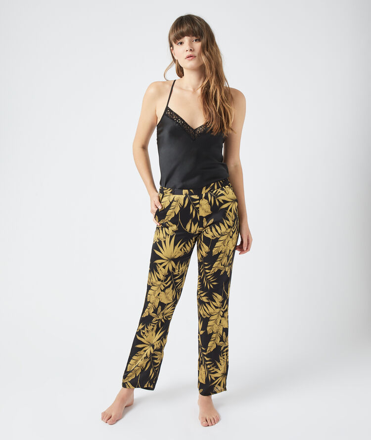 Pantalon imprimé feuillage noir.