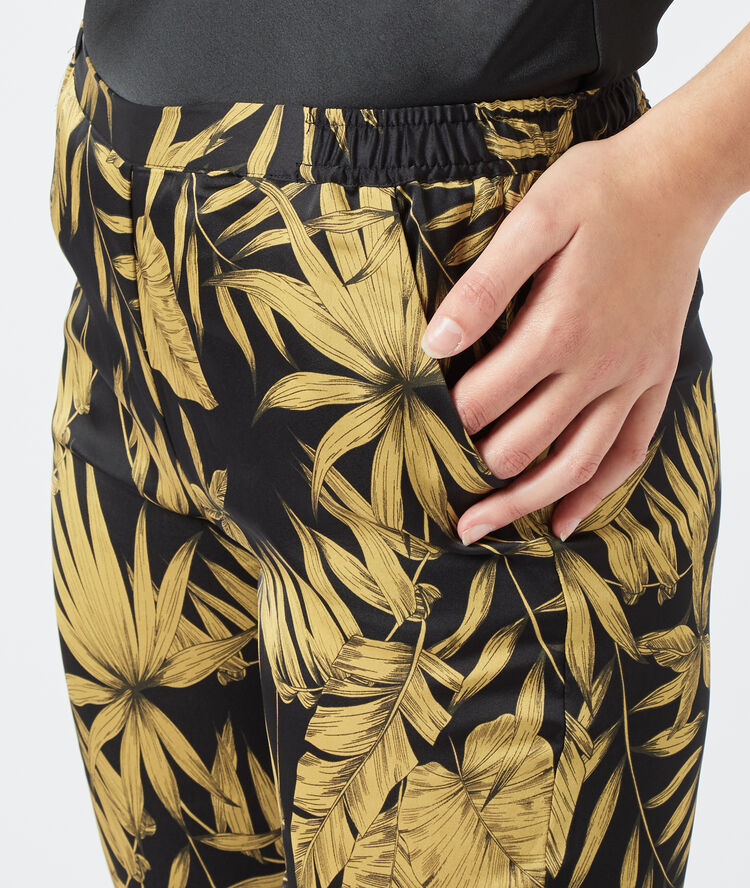 Pantalon imprimé feuillage noir.