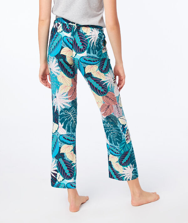 Pantalon imprimé feuillage vert.