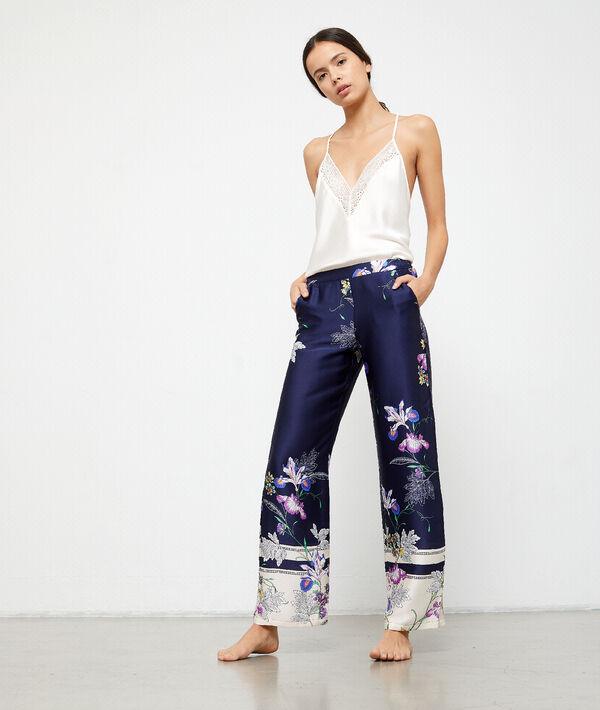 Pantalon satiné imprimé fleuri bleu.
