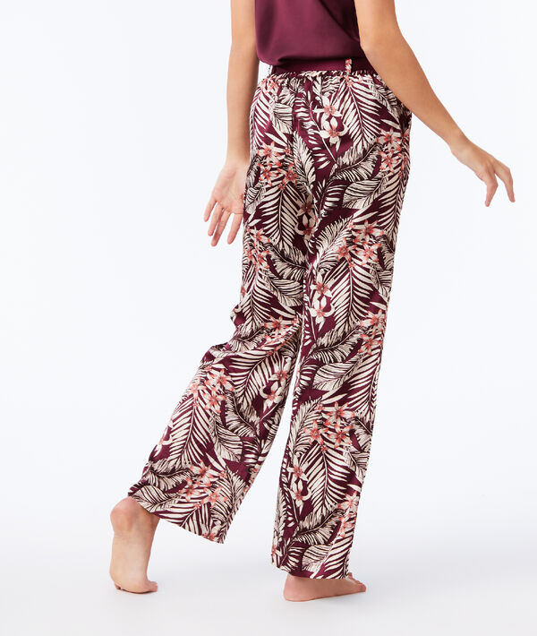 Pantalon large imprimé floral bordeaux grenat.
