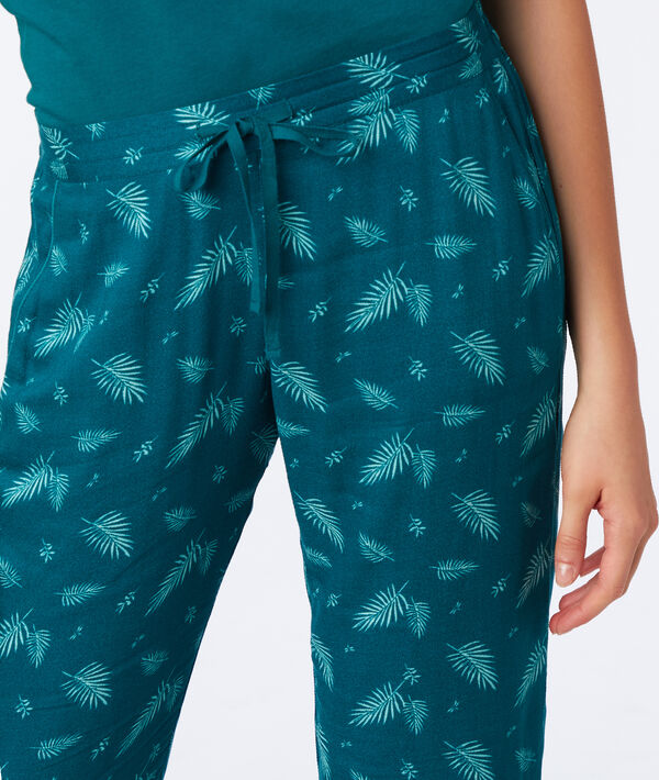Pantalon imprimé plume vert.