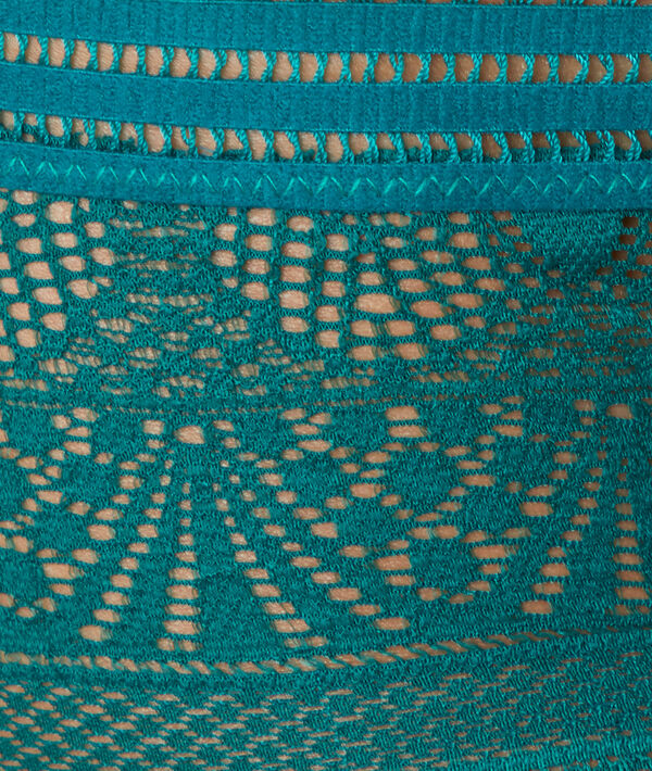 Tanga en dentelle emeraude.