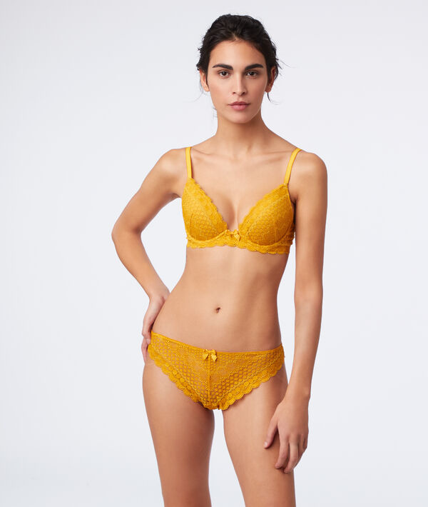 Tanga en dentelle bouton d'or.