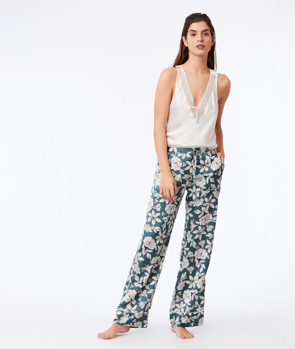 Pantalon large imprimé floral vert.