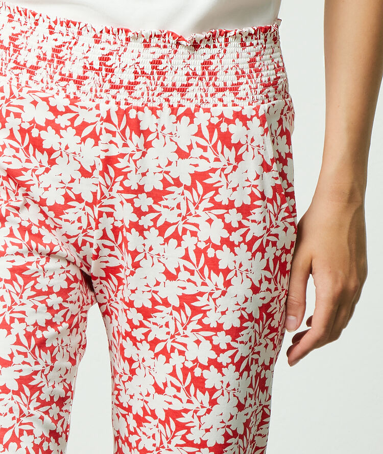 Pantalon imprimé floral corail.