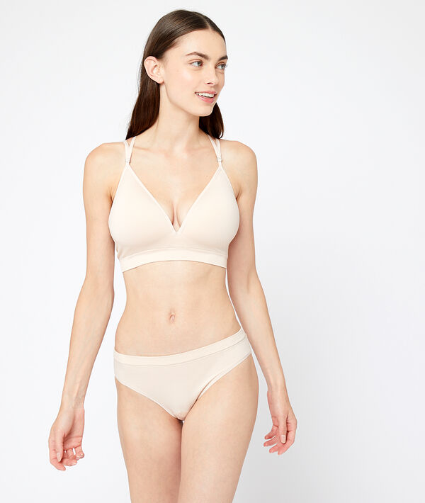Soutien-gorge sans armatures, dos croisé rose poudre.