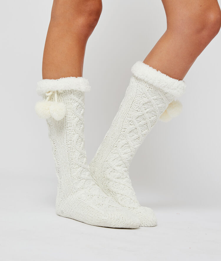 Chaussettes hautes à pompons ecru.