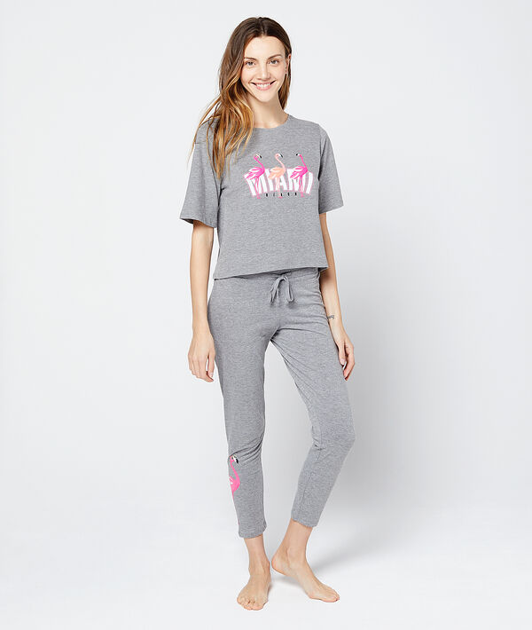 Pantalon imprimé flamand rose au bas gris.