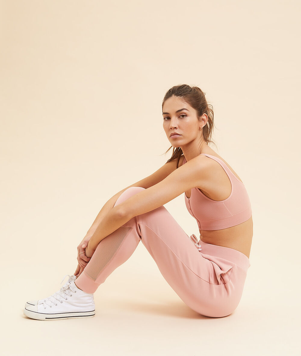 Pantalon de sport détails en tulle rose poudre.