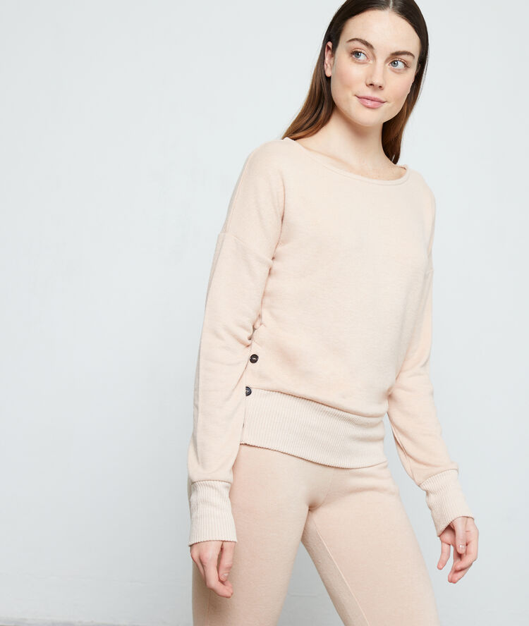 Top manches longues, détails boutons rose.