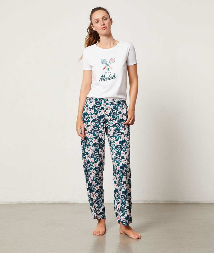 Pantalon imprimé floral vert.