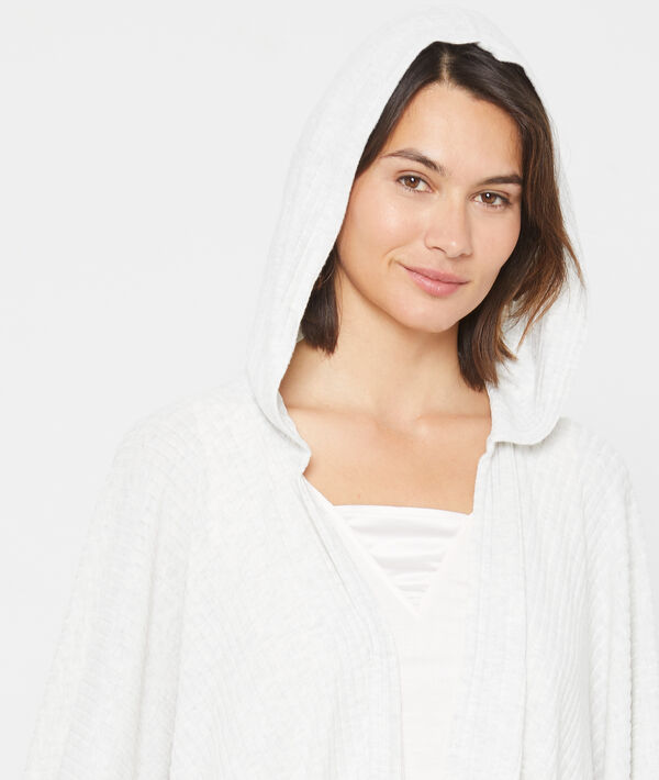 Gilet long et fluide en maille côtelée ecru.
