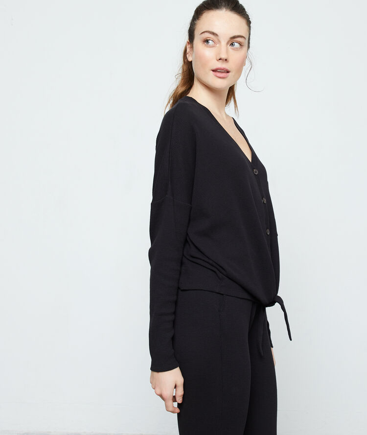 Top manches longues en coton noir.