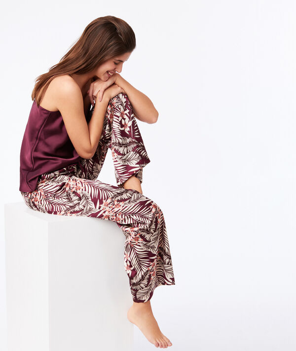 Pantalon large imprimé floral bordeaux grenat.