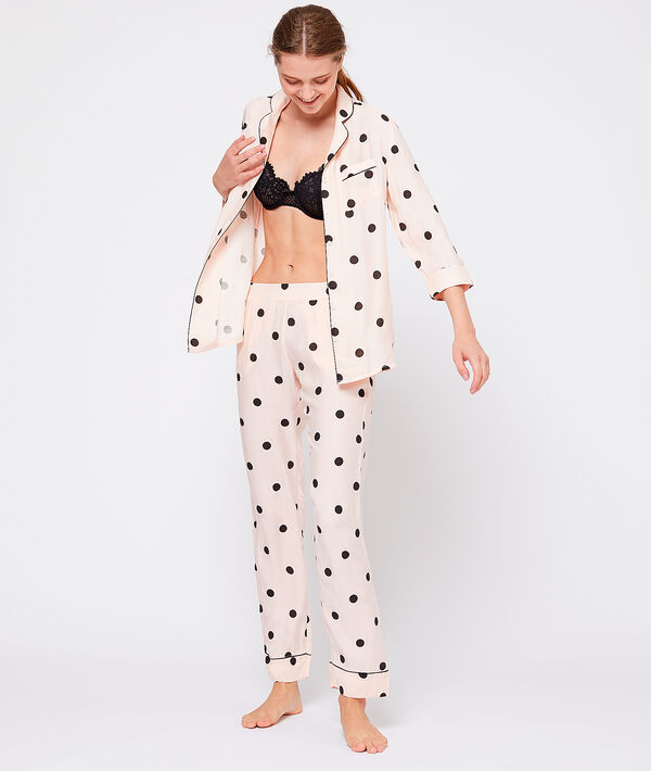 Pantalon à pois rose.