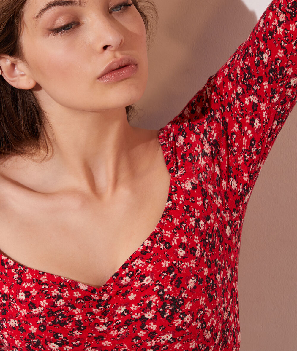 Body manches longues imprimé fleuri rouge.