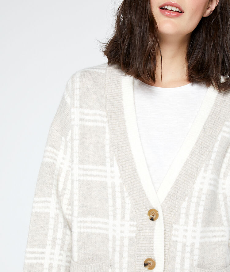 Gilet à carreaux en grosse maille beige rose.