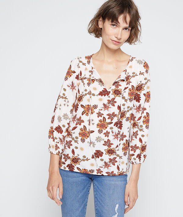 Blouse à imprimé floral ecru.