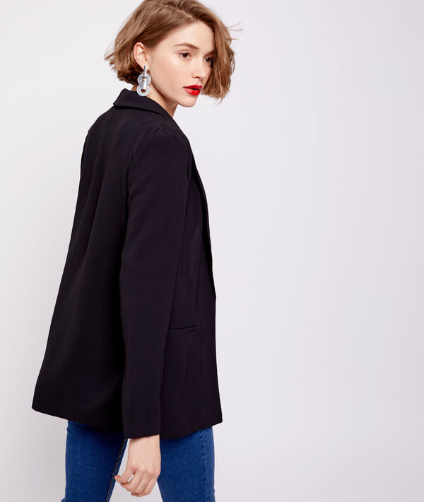 Veste de tailleur noir.