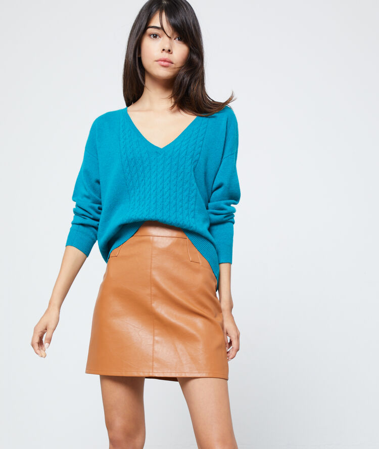 Pull torsadé en cachemire turquoise.