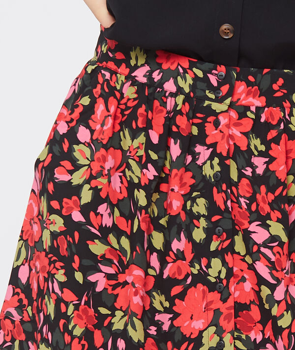 Jupe fluide à imprimé floral noir.