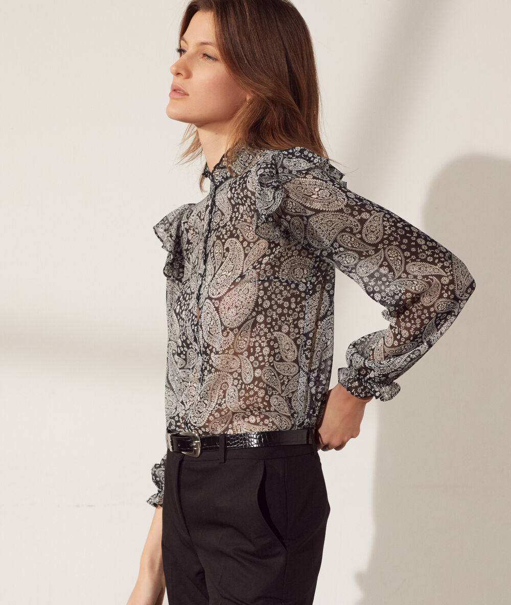 Chemise transparente manches volants noir.