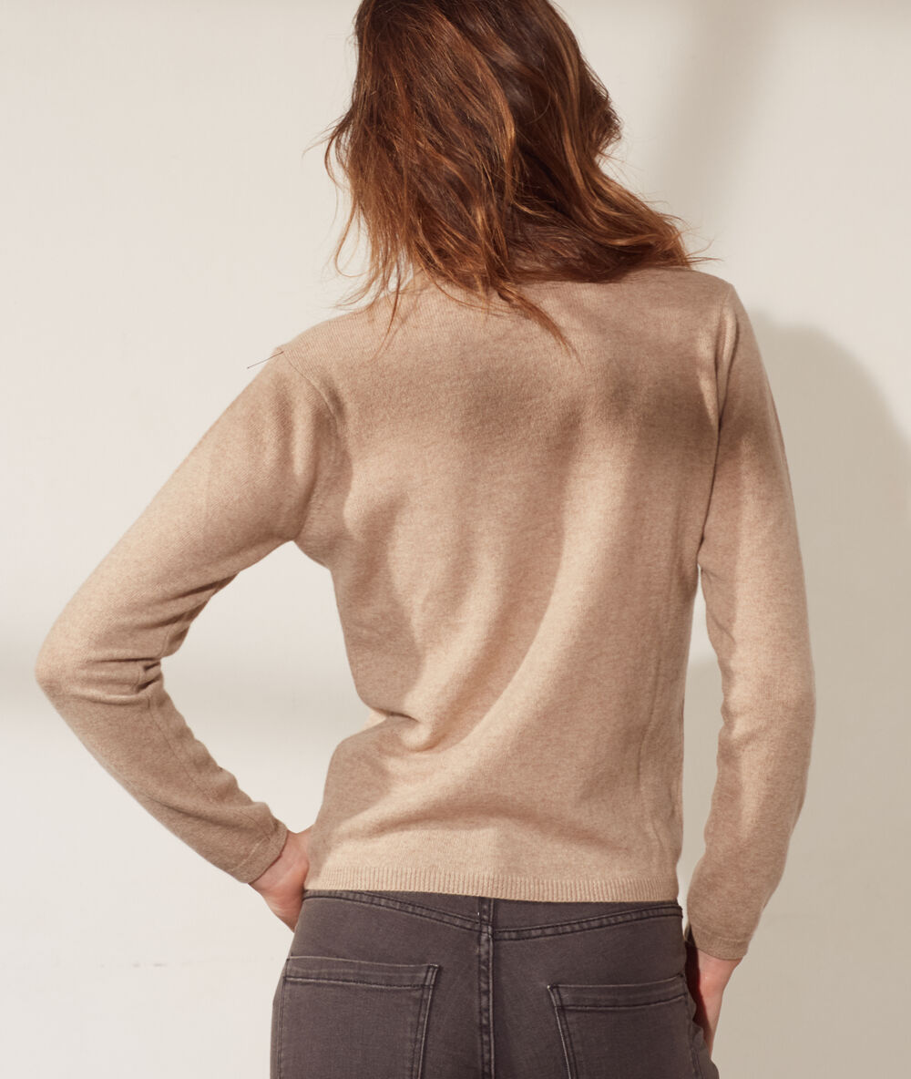 Pull col roulé en cachemire camel.