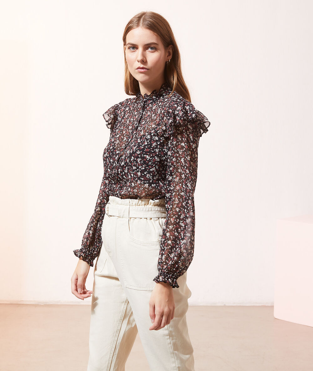 Chemise transparente manches volants noir.