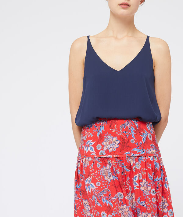 Jupe taille haute à fleurs rouge.