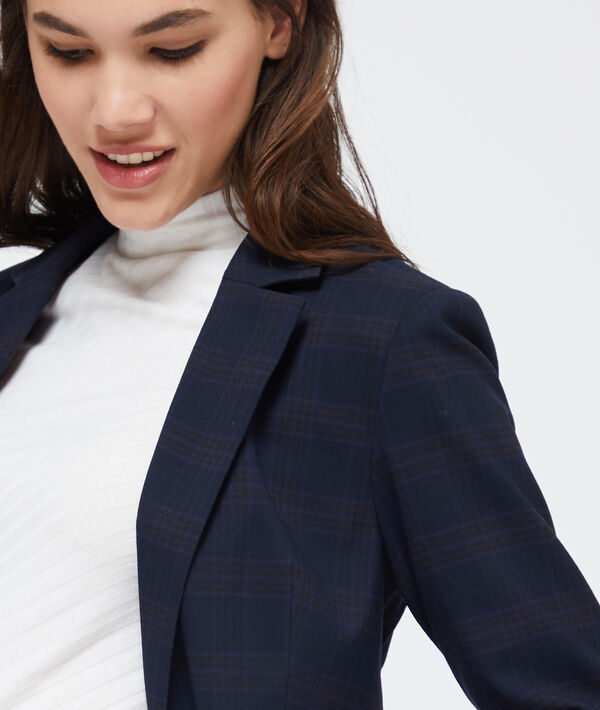 Veste de tailleur à carreaux marine.