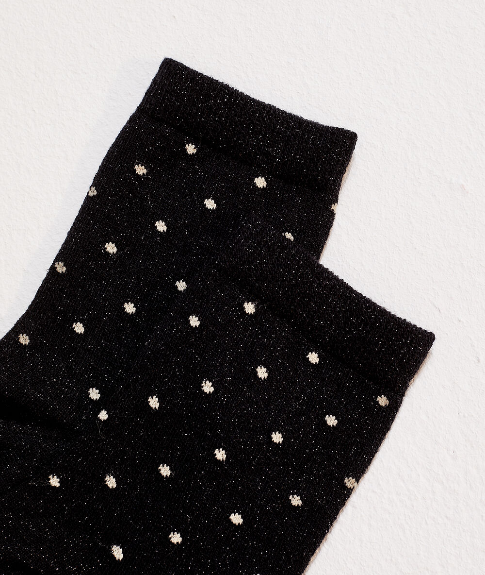 Chaussettes pois à fils métallisés noir.