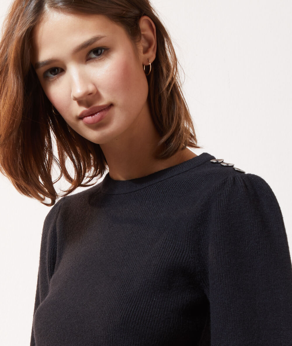 Pull manches ballon noir.
