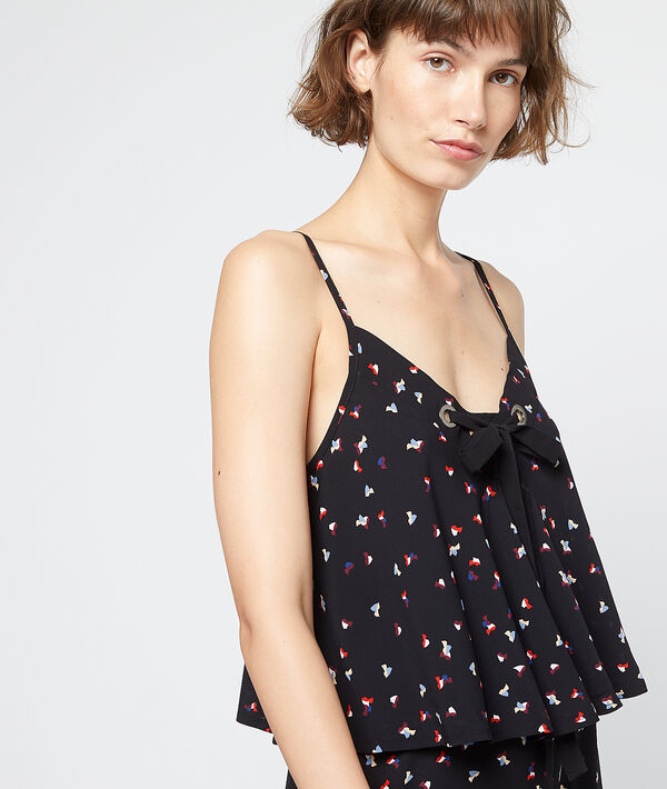 Robe longue nouée à volants noir.