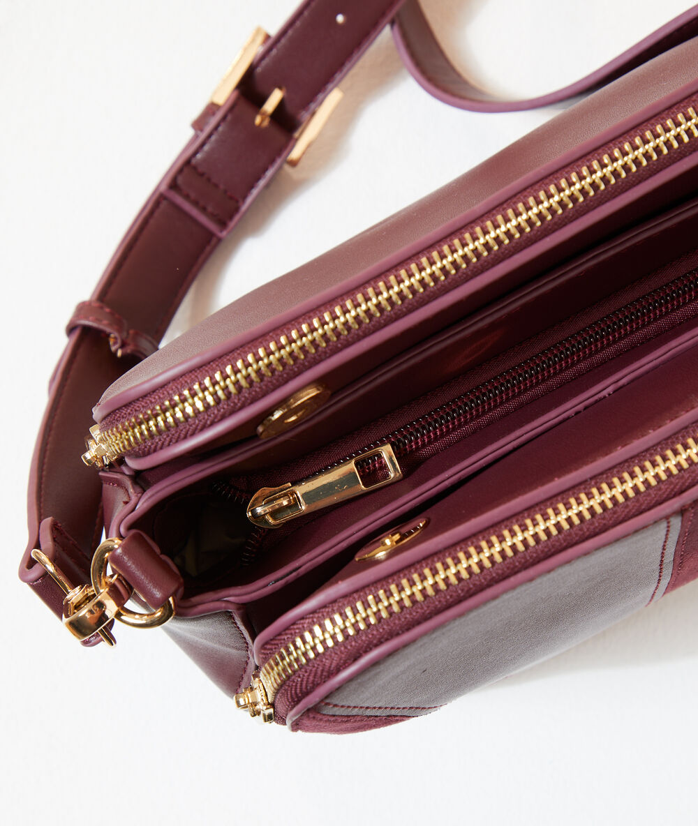 Sac besace bi-matière bordeaux.