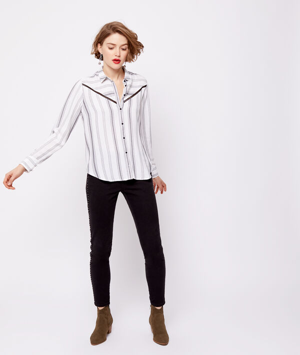 Pantalon slim à clous noir.